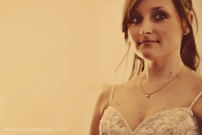 Candid portrait of a bride in the bridal suite just after she put on her wedding dress.