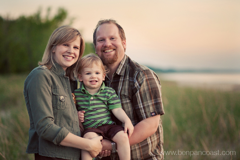 Family portrait at sunset on the beach in Southwest Michigan.