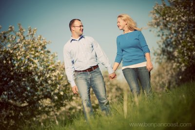 Engagement photos in an apple orchard.