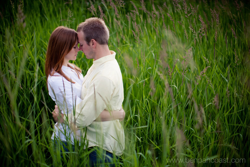 Engagement photo by the beach in tall grass.