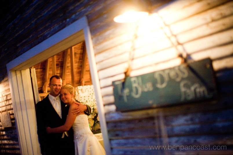 Wedding reception at a Barn in Michigan, bridal portrait of the bride and groom at night. The blue dress barn.