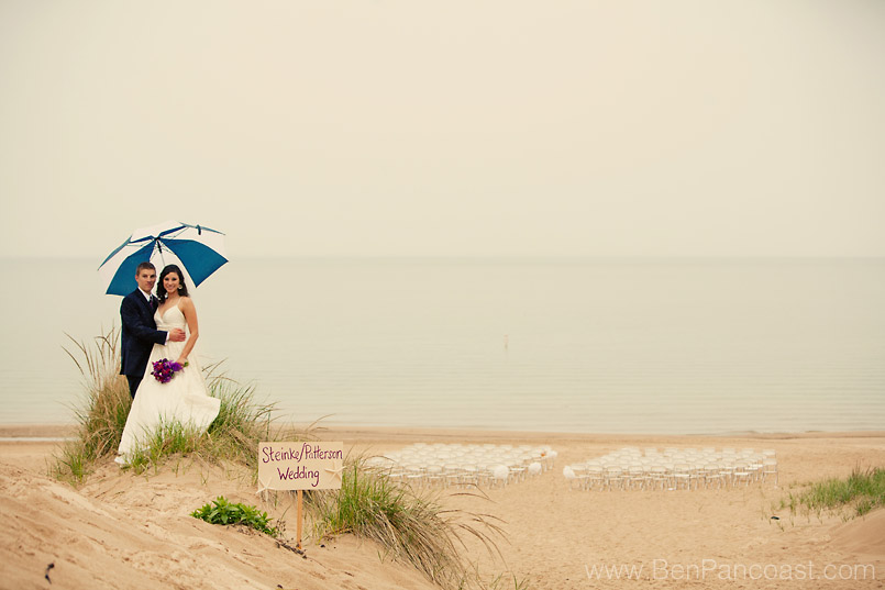 A beach wedding in the rain at Lake Bluff Inn and Suites in South Haven Michigan.