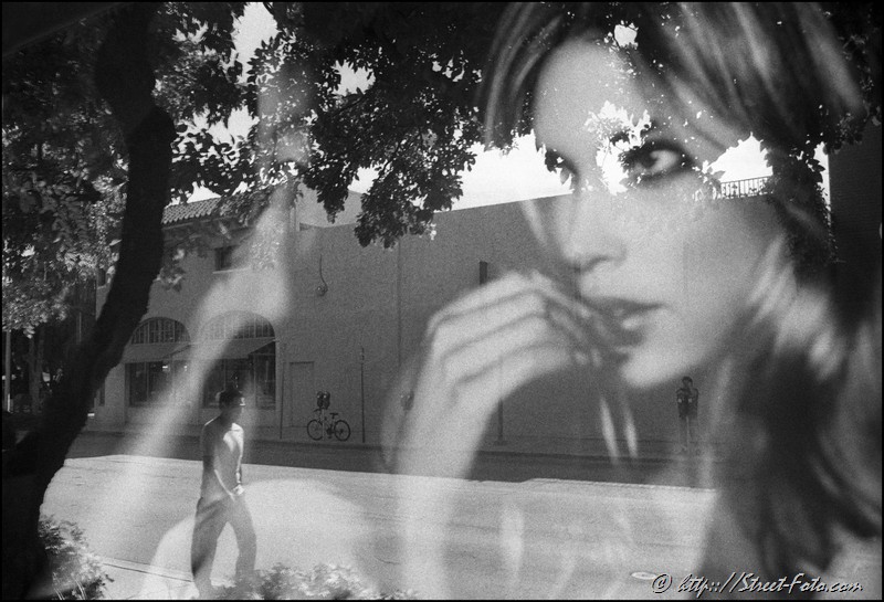 Reflection in 'Victoria's Secret' store's window on Lincoln road in South Beach, Miami, Florida, USA, 2010. Street Photography of Miami, San Francisco and Key West by Emir Shabashvili, see http://street-foto.com, http://miamistreetphoto.com, http://miamistreetphotography.com or http://miamistreetphotographer.com