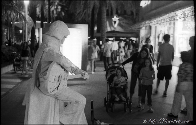 Night Street scene at Lincoln Road Mall in South Beach, Miami Beach, Florida, USA, 2011. Street Photography of Miami, San Francisco and Key West by Emir Shabashvili, see http://street-foto.com, http://miamistreetphoto.com, http://miamistreetphotography.com or http://miamistreetphotographer.com