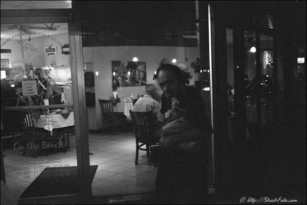 Homeless man leaving a caffe at Washington Avenue in Miami Beach, Florida, USA, 2011. Street Photography of Miami, San Francisco and Key West by Emir Shabashvili, see http://street-foto.com, http://miamistreetphoto.com, http://miamistreetphotography.com or http://miamistreetphotographer.com