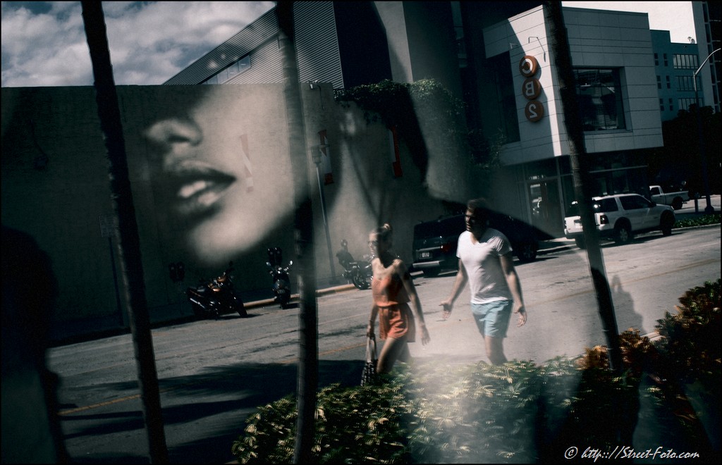 Street scene reflected in store window in Miami Beach, Florida, USA, 2011. Street Photography of Miami, San Francisco and Key West by Emir Shabashvili, see http://street-foto.com, http://miamistreetphoto.com, http://miamistreetphotography.com or http://miamistreetphotographer.com