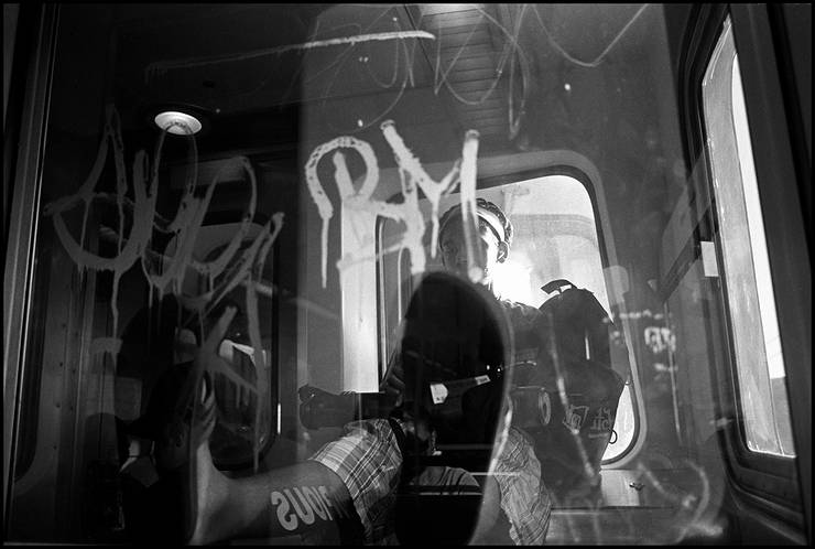 Boy, riding Miami Metrorail in the morning, Miami, Florida, USA, 2005. Street Photography of Miami, San Francisco and Key West by Emir Shabashvili, see http://street-foto.com, http://miamistreetphoto.com, http://miamistreetphotography.com or http://miamistreetphotographer.com
